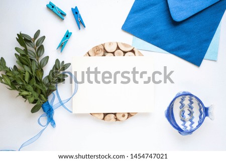 card mockup with leaves and blue envelope. minimalistic