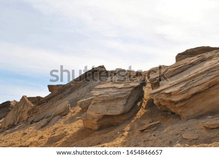 The top of the mountain with large stones on the background of a cloudy sky Royalty-Free Stock Photo #1454846657