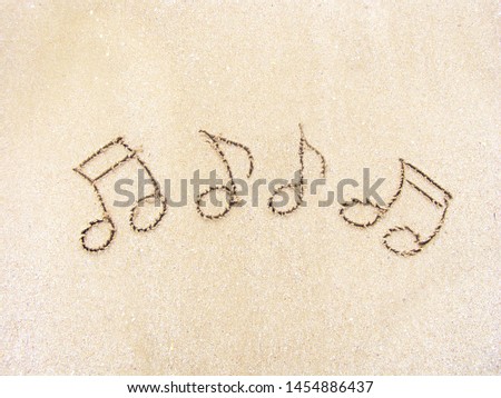 musical notes on the sand