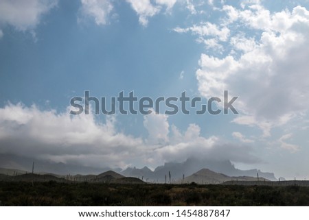 Landscape view of Big Bend National Park as a thunderstorm and clouds pass through near Chisos Basin (Texas).
