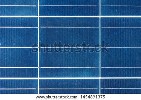Solar Energy solar cell connections, silicon and encapsulant a nice technology blue pattern. Perspective view of the Poly crystalline silicon Solar Cells around the Solar Panel. Nice textured pattern
