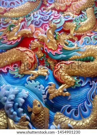 The walls are decorated with Chinese art, Chinese dragon in a Chinese temple .