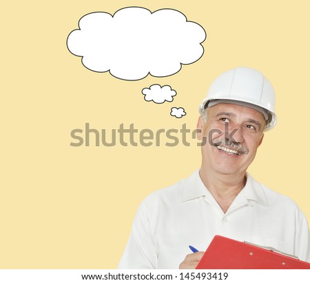 Senior constructor with clipboard looking away over yellow background