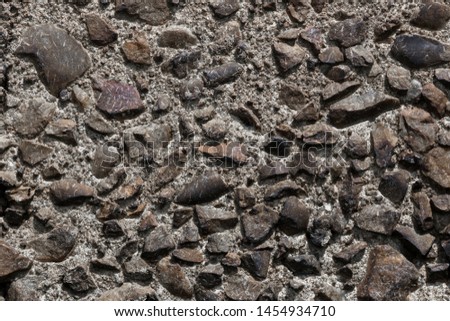 Texture with irregular stones on a wall, Madrid.
