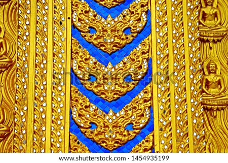 Decorative Thai style golden stucco on the roof & the wall of Church in Thai temple 