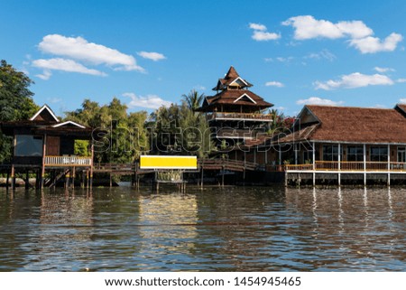 Wide angle picture of local burmese architecture building built over the water, located in Inle lake, Myanmar