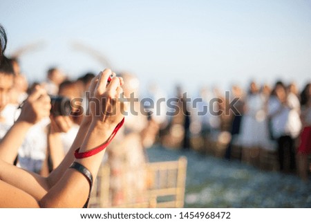 young asian women hand holding camera