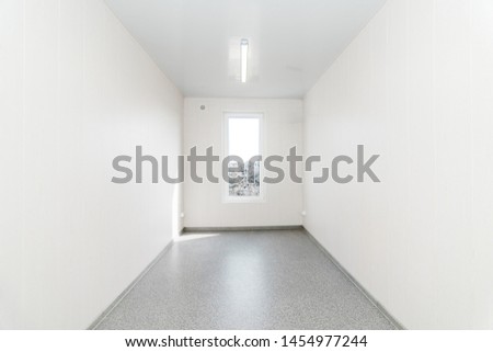 The photo of light white empty office room with bright lighting