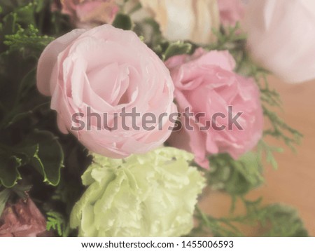 Bouquet of mixed flowers on wood background, Roses, Carnation, Eustoma, dry flowers.