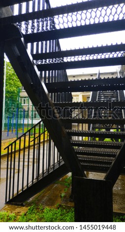 Steel black construction with an interesting design in the form of a staircase with steps leading upwards