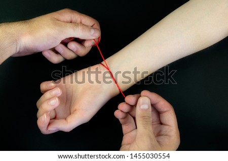 Red thread on a black background in the cart