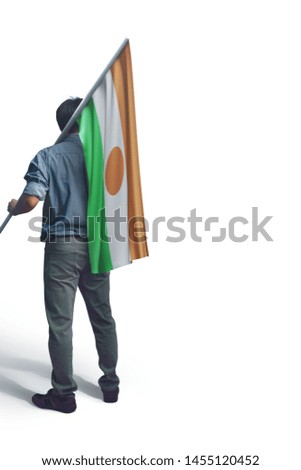 Young man holding Niger Flag in White Background, Flag of Niger