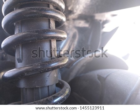 Motorcycle shock absorber a device for absorbing jolts and vibrations, especially on a motor vehicle. focus on suspension. Closeup of springs