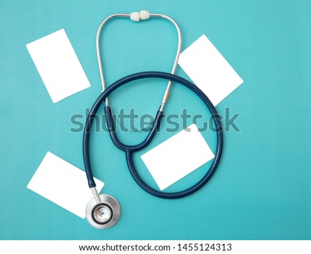 Stethoscope and blank empty card.