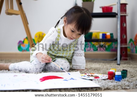 Asian cute little child girl drawing at home. Education concept