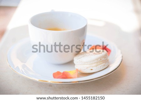 Macaroons combination with flowers and coffee