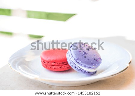 Macaroons combination with flowers and coffee