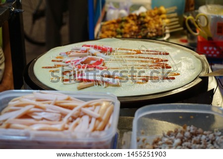 Thai street food. crab sticks, minced pork crepes with sauce. Royalty-Free Stock Photo #1455251903