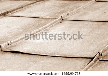 Old metal roof in brown tone. Abstract background and texture for design.