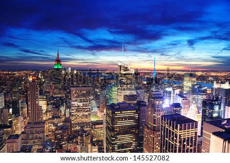 New York City skyline aerial view at dusk with colorful cloud, Empire State and skyscrapers of midtown Manhattan.