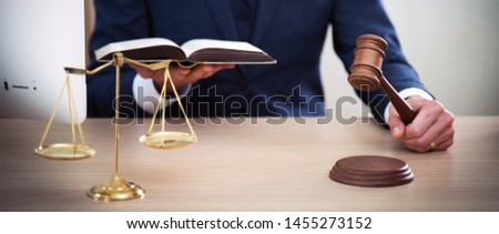 Lawyer businessman working or reading lawbook in office workplace for consultant lawyer concept.