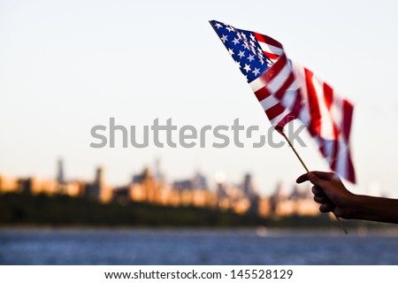 American flag during Independence Day on the Hudson River with a view at Manhattan - New York City (NYC) - United States of America