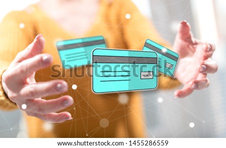 Credit card concept between hands of a woman in background