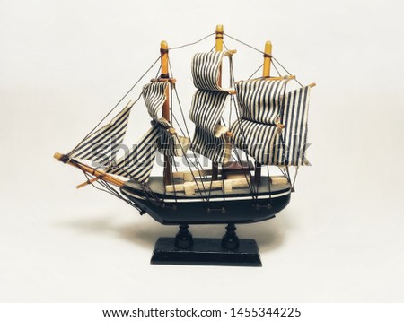 model sail ship sail boat sailing on white floor light box blue strip sail clotch