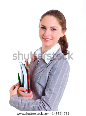 Portrait of university girl holding books and smiling. Isolated over white background.