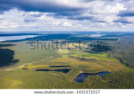 Highway Scandinavia from a bird's eye view. In the frame of the forest, lakes, highway.