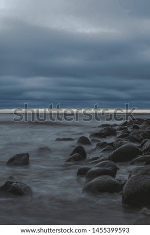 Photo of a Baltic sea coast in evening. Cool weather and wind. Long exposure, hdr shots.