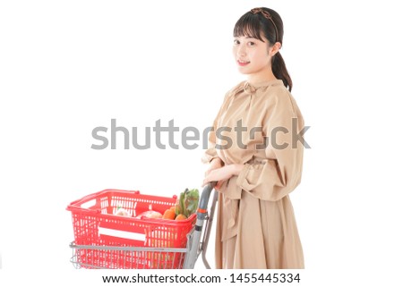 Young women buying groceries at supermarket