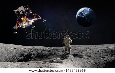 Moon surface with astronaut and landing space craft. Planet Earth on the background. Apollo space program. Elements of this image furnished by NASA.