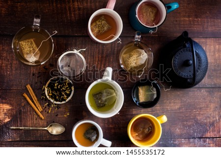 top view of colorful group of cups with different teas
