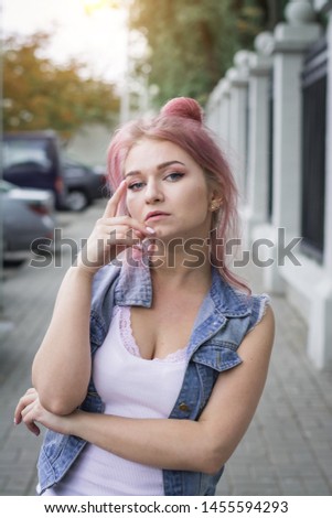 Beautiful teen girl with ash-pink hair in city street, lifestyle concept