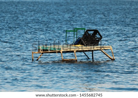 Makeshift fishing platform in water