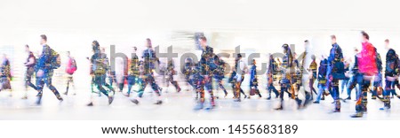 Beautiful motion blur of walking people. Early morning rush hours, busy modern life concept. Ideal for websites and magazines layouts