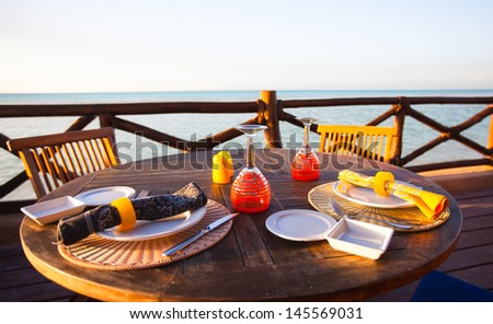 served open air table on the porch at sunset