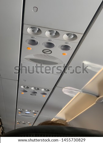 Plane's overhead control panel. Oxygen mask compartment.