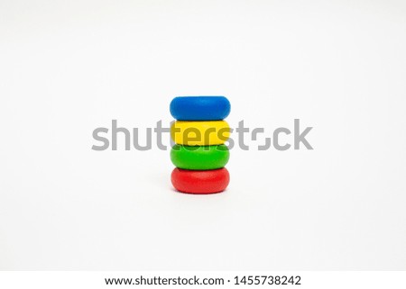 Toy wooden blocks, multicolor building construction bricks over white background. Early education concept.