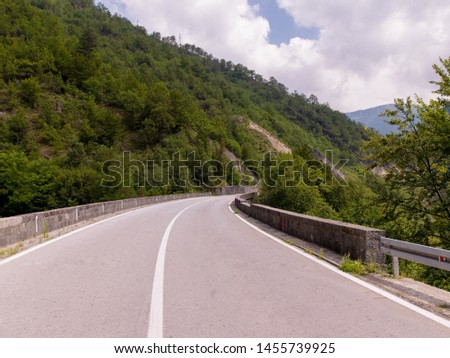 asphalt road in beautiful countryside on sunny summer day