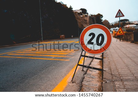 number 20 traffic limit sign on the road