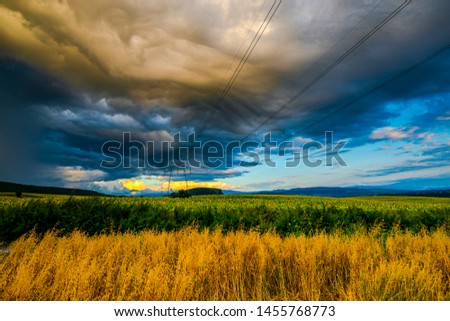 Storm clouds at the sunset in the summer