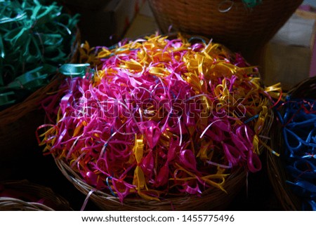 Colorful flowers made from ribbons for sales, special occasions like Valentine's day gift wrapping.