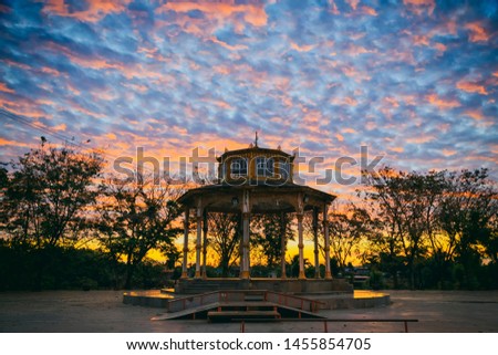 Abstract silhouette photography of Thailand style pavilion with sunset or sunrise sky background.