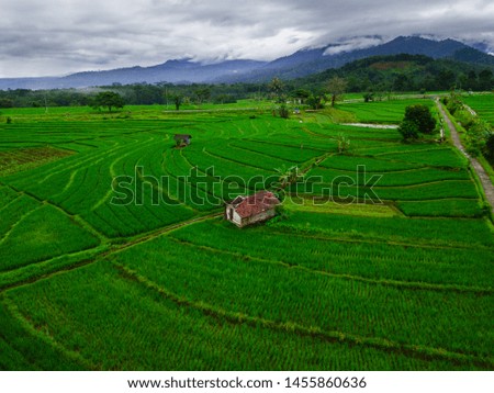 Indonesia's natural beauty of Sumatra, where green rice fields with high mountains and beautiful blue clouds for a relaxing trip beauty morning