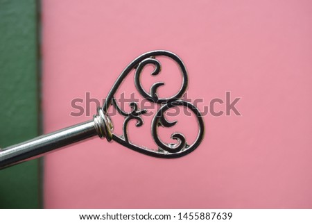 metal heart on pastel background