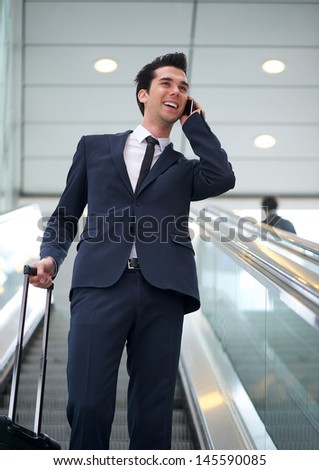 Portrait of a attractive young businessman talking on mobile phone