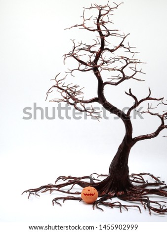 Halloween background. Space for text.Silhouette dead tree on dark dramatic sky background for scary or death. Hopeless, despair,sad and lament concept. Scary forest. Dramatic horror night on Halloween