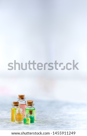 Colored essantial oil bottles of aromatherapy oils isolated close-up.